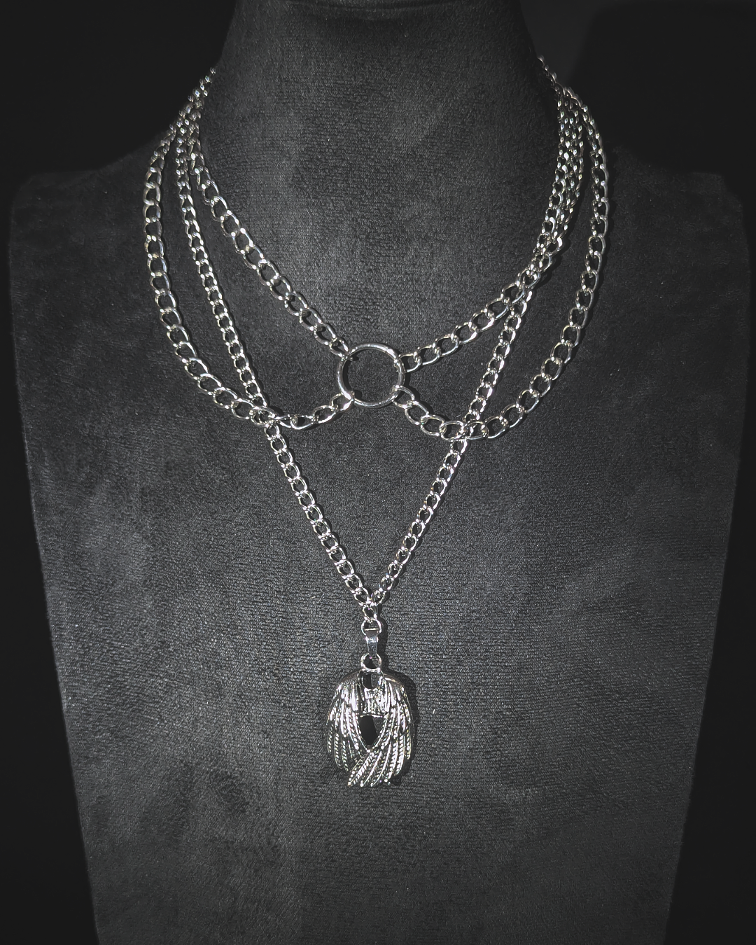 Multi layered chain with winged pendant